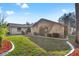 Charming single-story home showcases stone accents, manicured lawn, and mature landscaping at 1011 Altoona Ave, Spring Hill, FL 34609