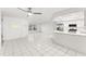 Clean and bright open floor plan with breakfast bar and views into adjacent spaces at 1011 Altoona Ave, Spring Hill, FL 34609