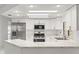 Modern kitchen with stainless steel appliances, white cabinets, and ample countertop space at 1011 Altoona Ave, Spring Hill, FL 34609