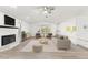 Bright living room featuring a fireplace, neutral color palette, and vaulted ceilings at 1011 Altoona Ave, Spring Hill, FL 34609
