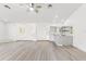 Bright living room features a wet bar, neutral walls and flooring, and recessed lighting at 1011 Altoona Ave, Spring Hill, FL 34609