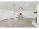 Open living space with light wood floors, wet bar, and ample natural light at 1011 Altoona Ave, Spring Hill, FL 34609