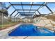 Inviting screened-in pool with spacious deck offers a perfect spot for relaxation and outdoor enjoyment at 1011 Altoona Ave, Spring Hill, FL 34609
