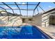 The screened-in pool and spa are perfect for cooling off on a hot day or enjoying a relaxing evening at 1011 Altoona Ave, Spring Hill, FL 34609