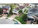 Aerial view of a well-maintained two-story home with manicured lawn, landscaping, and a paved driveway in a residential neighborhood at 11611 Lake Blvd, New Port Richey, FL 34655