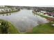 Scenic aerial shot of a lakefront community with beautiful homes and lush landscaping at 11611 Lake Blvd, New Port Richey, FL 34655