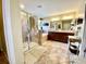 Large bathroom with shower, bathtub, and double sinks. Featuring neutral tile at 11611 Lake Blvd, New Port Richey, FL 34655