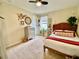 Inviting bedroom with warm tones, woven headboard, and lots of plants at 11611 Lake Blvd, New Port Richey, FL 34655