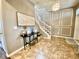 Inviting foyer with stairs, tiled floor, and decorative wall trim at 11611 Lake Blvd, New Port Richey, FL 34655