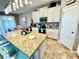 Open concept kitchen with a large island, granite countertops, and stainless steel appliances at 11611 Lake Blvd, New Port Richey, FL 34655