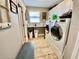 Well-organized laundry room with modern washer and dryer, storage cabinets, and neutral colored walls at 11611 Lake Blvd, New Port Richey, FL 34655