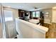 Loft space featuring wood floors and a wood paneled accent wall at 11611 Lake Blvd, New Port Richey, FL 34655