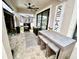 Covered outdoor seating area with bar, stools, and patio access, perfect for entertaining at 11611 Lake Blvd, New Port Richey, FL 34655