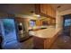 Kitchen with wood cabinets and a stainless steel refrigerator at 13140 Moon Rd, Brooksville, FL 34613