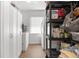 Functional laundry room with ample storage space, featuring built-in cabinets and modern appliances at 13819 Eagles Rock Ct, Hudson, FL 34667