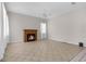 Living room with fireplace, fan and tile flooring at 14356 Bronte Ct, Hudson, FL 34667