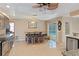 Dining area featuring a wooden table and access to the kitchen and sliding door to the pool at 14448 Linden Dr, Spring Hill, FL 34609