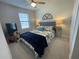 Cozy bedroom with carpeted floors, ceiling fan and ample natural light at 15384 Caravan Ave, Odessa, FL 33556
