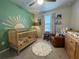 Charming Bedroom with cute decor, stylish furniture and playful wall art at 15384 Caravan Ave, Odessa, FL 33556