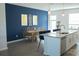 Open dining area next to kitchen with stylish pendant lights and accent wall at 15384 Caravan Ave, Odessa, FL 33556