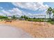 Community playground with swings, climbing structures, and a soft wood-chip ground cover at 15384 Caravan Ave, Odessa, FL 33556