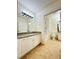 Bathroom featuring granite countertops and tiled floors at 19325 Water Oak Dr # 205, Port Charlotte, FL 33948