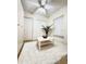 Bright living room features a ceiling fan, white accents, two large closets and a soft shag rug at 19325 Water Oak Dr # 205, Port Charlotte, FL 33948