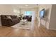 The living room features two couches, a white rug and table, and a mounted TV at 19325 Water Oak Dr # 205, Port Charlotte, FL 33948