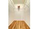 Walk-in closet with hardwood floors and wire shelving, providing ample storage space at 19325 Water Oak Dr # 205, Port Charlotte, FL 33948