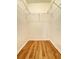 Walk-in closet with hardwood floors and wire shelving for organization at 19325 Water Oak Dr # 205, Port Charlotte, FL 33948