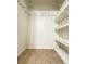 Walk-in closet with shelving, ready to customize, for optimal storage, and easy organization at 19325 Water Oak Dr # 205, Port Charlotte, FL 33948