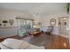 Inviting living room featuring hardwood floors and warm natural light at 2050 Quailwood Ln, Spring Hill, FL 34606