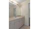 Bathroom with a neutral color palette, wide vanity, and ample lighting above the sink at 2124 Godfrey Ave, Spring Hill, FL 34609