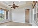 Light bedroom with a ceiling fan and windows bringing in the natural light at 2422 Caribou Dr, Spring Hill, FL 34608