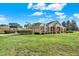 Attractive home with stone accents, an attached garage, and manicured landscaping at 2422 Caribou Dr, Spring Hill, FL 34608