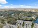 Aerial view of condo community featuring water views and lush greenery at 2764 Countryside Blvd # 3, Clearwater, FL 33761