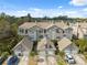 Aerial view of townhomes with mature landscaping and private garages and driveways at 2764 Countryside Blvd # 3, Clearwater, FL 33761