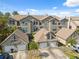Aerial view of condo buildings featuring multiple garages and front entrances at 2764 Countryside Blvd # 3, Clearwater, FL 33761