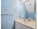 Bathroom featuring a vanity sink with a large mirror at 2764 Countryside Blvd # 3, Clearwater, FL 33761