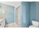 Bathroom featuring tile floors, shower with glass door, toilet and vanity at 2764 Countryside Blvd # 3, Clearwater, FL 33761