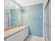 Bathroom featuring tile floors, shower with glass door, toilet and vanity at 2764 Countryside Blvd # 3, Clearwater, FL 33761
