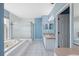 Bright Primary bathroom with a soaking tub, walk-in shower, and double sink vanity with ample counter space at 2764 Countryside Blvd # 3, Clearwater, FL 33761