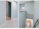 Hallway with washer and dryer, next to bathroom with glass shower at 2764 Countryside Blvd # 3, Clearwater, FL 33761