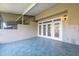 Tiled lanai featuring access doors to both inside and outside at 2764 Countryside Blvd # 3, Clearwater, FL 33761