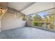 Enclosed lanai with tiled floor and view of the well maintained backyard at 2764 Countryside Blvd # 3, Clearwater, FL 33761