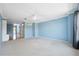Spacious living room with ceiling fan and wall to wall carpet at 2764 Countryside Blvd # 3, Clearwater, FL 33761