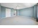 Large main bedroom features neutral walls, carpet, ceiling fan, and multiple closets for ample storage at 2764 Countryside Blvd # 3, Clearwater, FL 33761