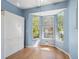 Sitting room with a bay window providing great light and built in cabinetry at 2764 Countryside Blvd # 3, Clearwater, FL 33761