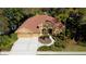 Attractive single-story home with terracotta roof tiles, complemented by mature landscaping and a spacious driveway at 2806 Grey Oaks Blvd, Tarpon Springs, FL 34688