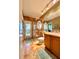 Bathroom featuring a glass-enclosed shower, tiled floors, and wooden vanity at 2806 Grey Oaks Blvd, Tarpon Springs, FL 34688